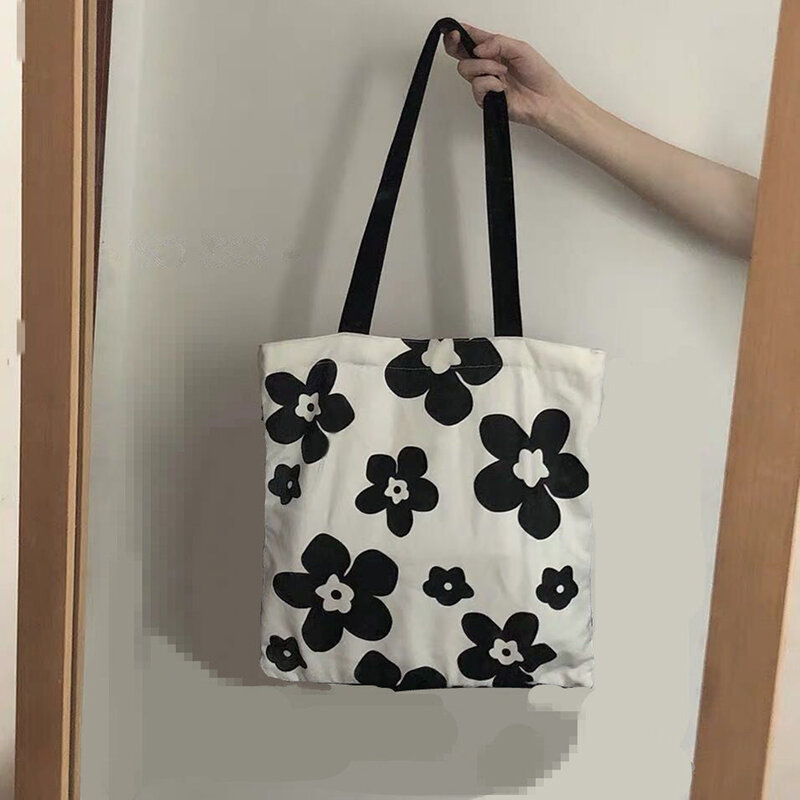 กระเป๋าผ้าใบสีดำสีขาวสำหรับผู้หญิงกระเป๋าหิ้วทรงสี่เหลี่ยมความจุขนาดใหญ่ใหม่กระเป๋าสะพายไหล่นักเรียน