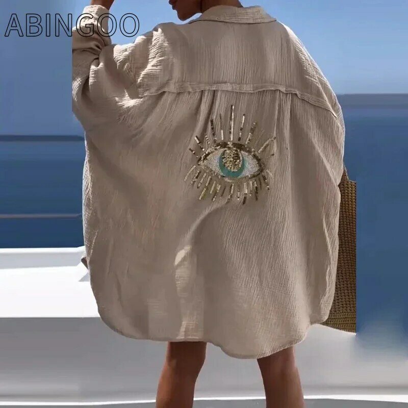 ABINGOO-قميص نسائي غير رسمي بترتر عين الشر ، قمة بيضاء ، حماية من الشمس ، كتان قطني ، بلوزة فضفاضة زائد ، موضة الشاطئ ، النساء