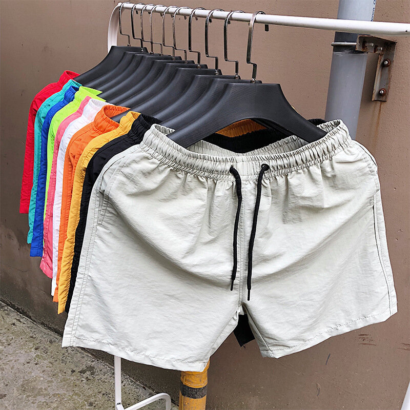 Celana pantai pria, celana luar olahraga longgar cepat kering, tipis, lima titik, warna permen, kasual, musim panas