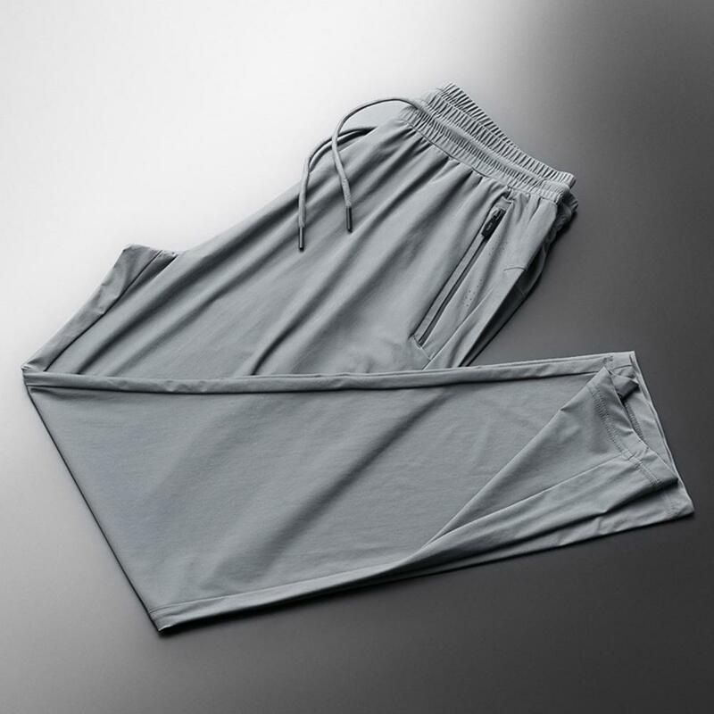 Spodnie sportowe męskie szybkoschnące, lodowy jedwab oddychające dziewięciopunktowe letnie spodnie do biegania luźna siatka spodnie klimatyzacyjne