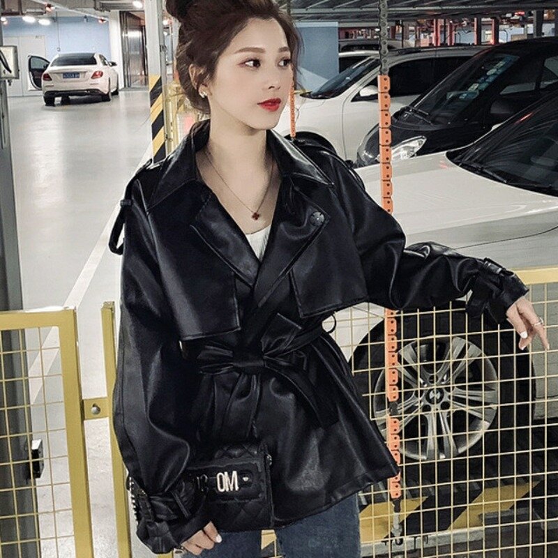 เสื้อฝนผูกเชือกยาวปานกลางหนัง PU สำหรับผู้หญิงเสื้อผ้าขี่มอเตอร์ไซค์สไตล์เกาหลีเอวแน่นเสื้อผ้าลำลองฤดูใบไม้ร่วงใหม่