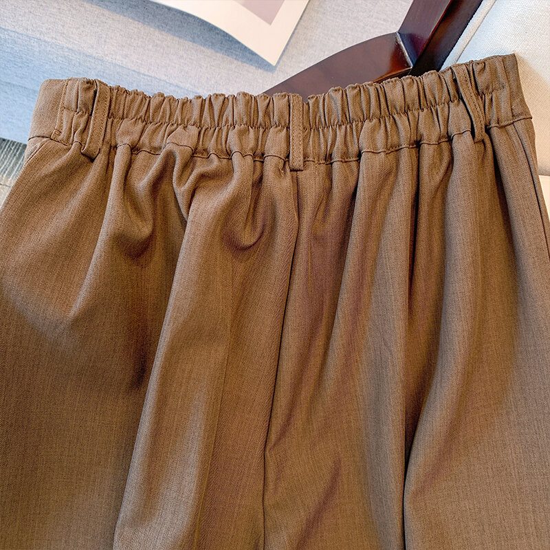 Wiosna na co dzień spodnie damskie w dużych rozmiarach brązowe poliestrowe spodnie z szerokimi nogawkami luźne wygodne spodnie podmiejskie w rozmiarze 160 Plus