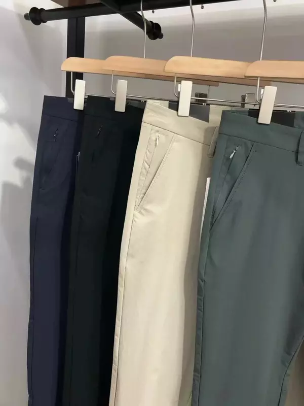 กางเกงวอร์มลำลองสี่ด้านแบบคลาสสิกบางแห้งเร็วสำหรับผู้ชายกางเกงสีทึบมีกระเป๋าซ่อนซิป