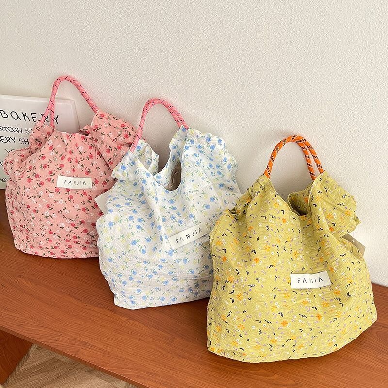 Tas kain motif bunga Ins versi Korea tas kanvas portabel lipat kapasitas besar tas belanja Fashion tas pantai tipis musim panas wanita