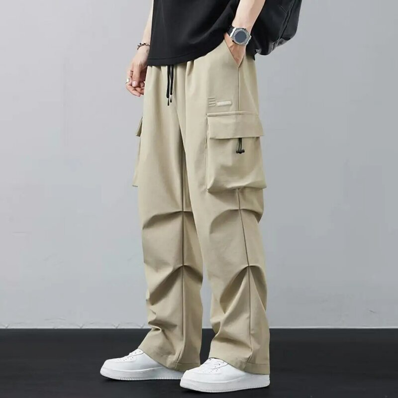 Calça de perna larga masculina com bolsos múltiplos, cintura de cordão, estilo hip-hop para trabalho, treinamento de academia estilo rua