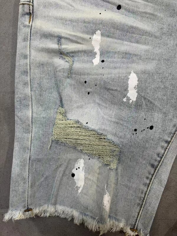 Pantaloncini di jeans personalizzati strappati con inchiostro Splash nuovo stile estivo pantaloncini larghi al ginocchio da uomo