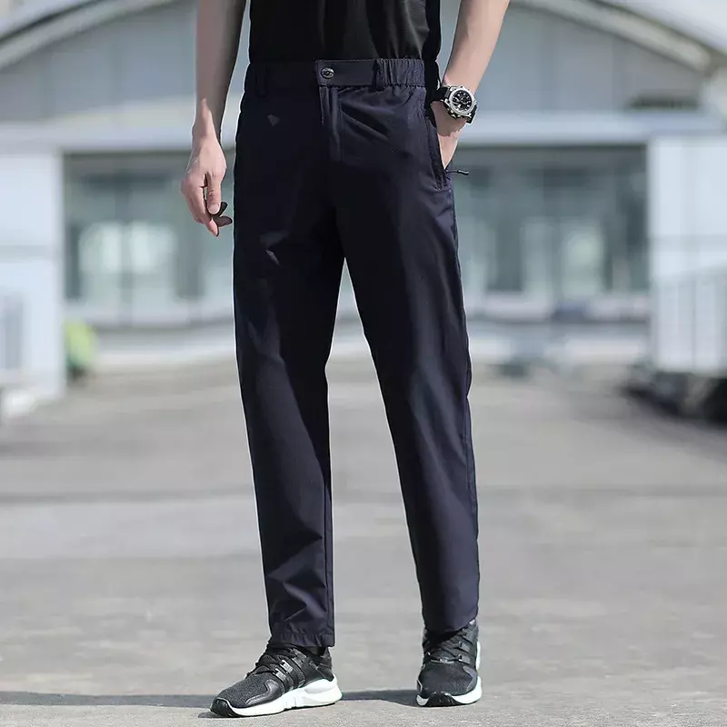 Pantalones de verano de talla grande para hombre, pantalones elásticos de seda de hielo, transpirables, de pierna recta, 6XL, de secado rápido, con banda elástica, color negro