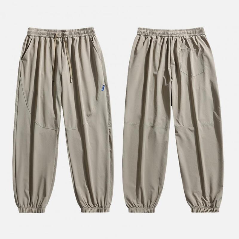 Calça de cintura ajustável masculina, calça elástica, calça esportiva de secagem rápida com bolsos laterais, cordão para jogging