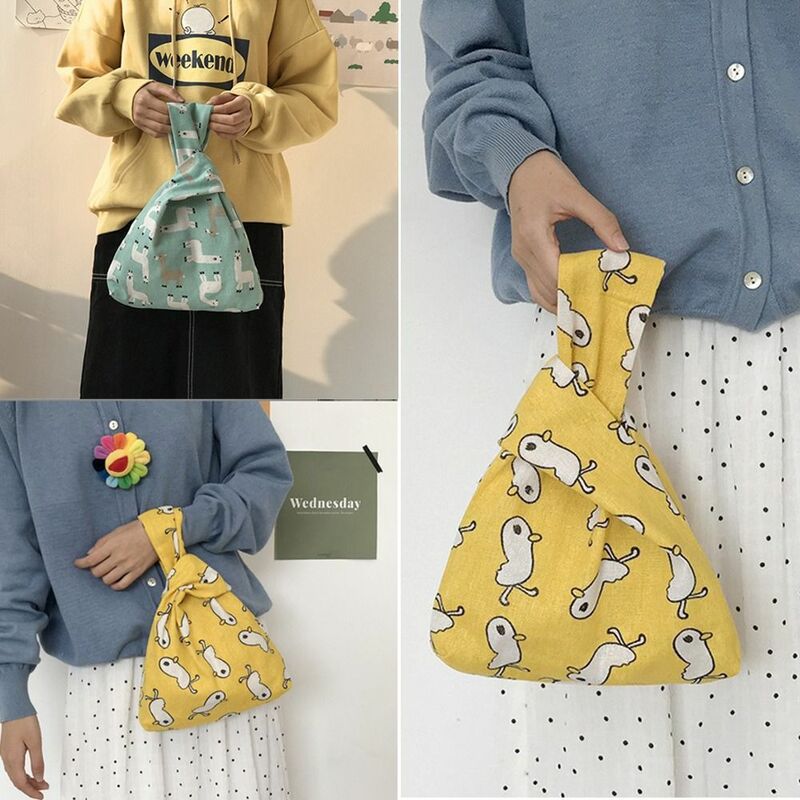 Bolso de mano de lona de dibujos animados para mujer y niña, bolsa de muñeca con nudo de gran capacidad, monedero informal, bolsas de compras