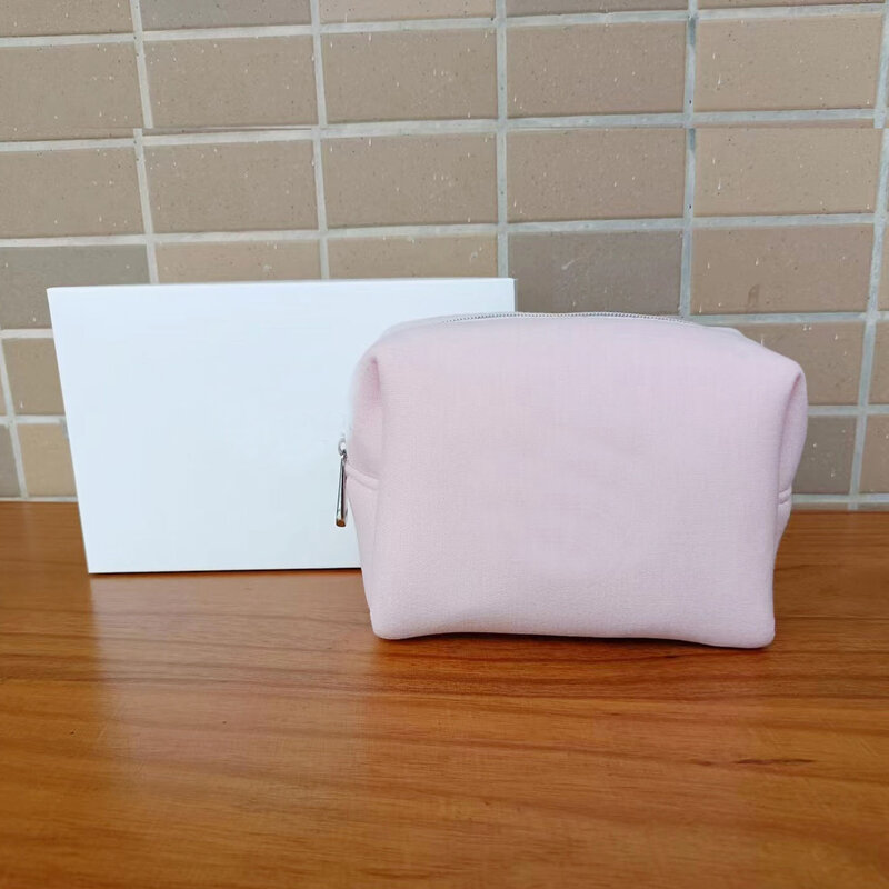Pink and white fragrance cosmetics storage bag, simple and fashionable space cotton makeup in hand