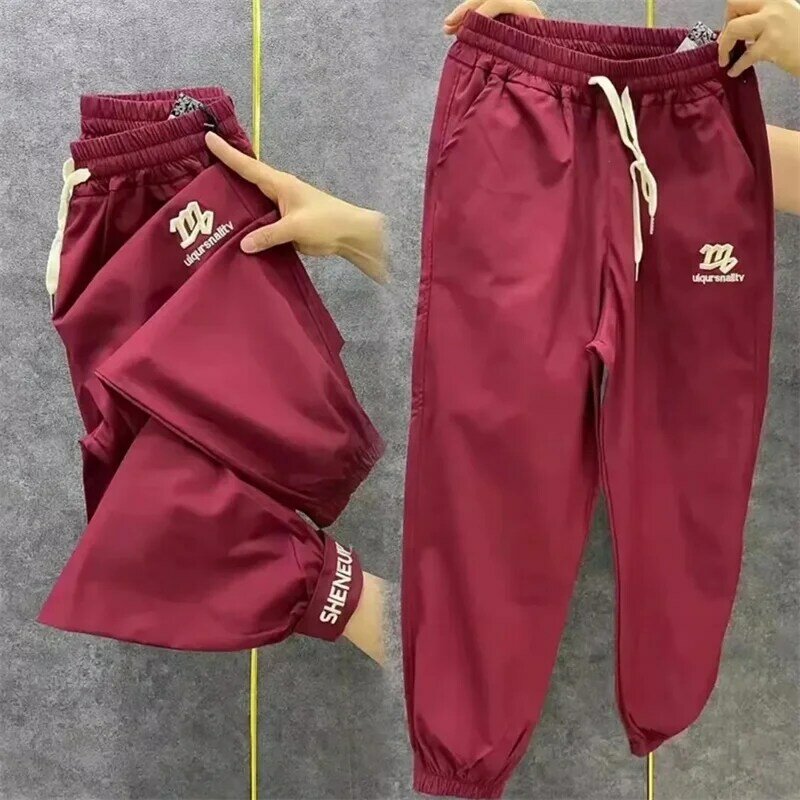 แฟชั่นใหม่2024กางเกงฮาเร็มผู้หญิงกางเกงกีฬาปักลายแห้งเร็วกางเกงผูกเอวยางยืดกางเกงลำลองของผู้หญิง