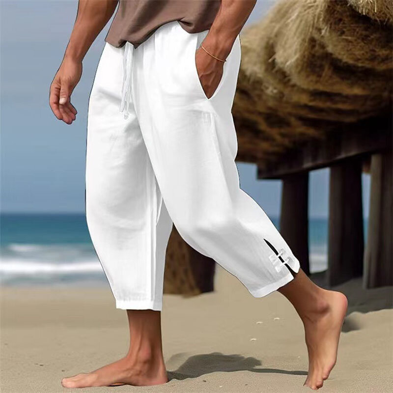 Celana Harem kasual pria, bawahan olahraga longgar sembilan menit bersaku pinggang elastis warna polos, bernafas kaki lebar musim panas
