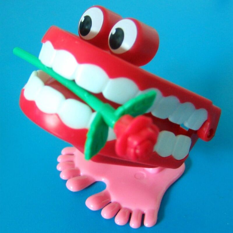 Juguete de relojería de plástico con forma de rosa y dientes para caminar, juguete de relojería para dentadura pequeña, divertido