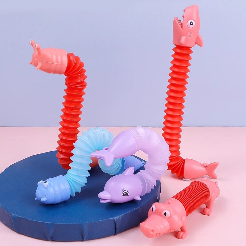 Brinquedos criativos do tubo da descompressão para crianças, dinossauro, tubarão, animal dos desenhos animados, DIY Stretch Toys, Keychain Pendant Gifts, 4pcs