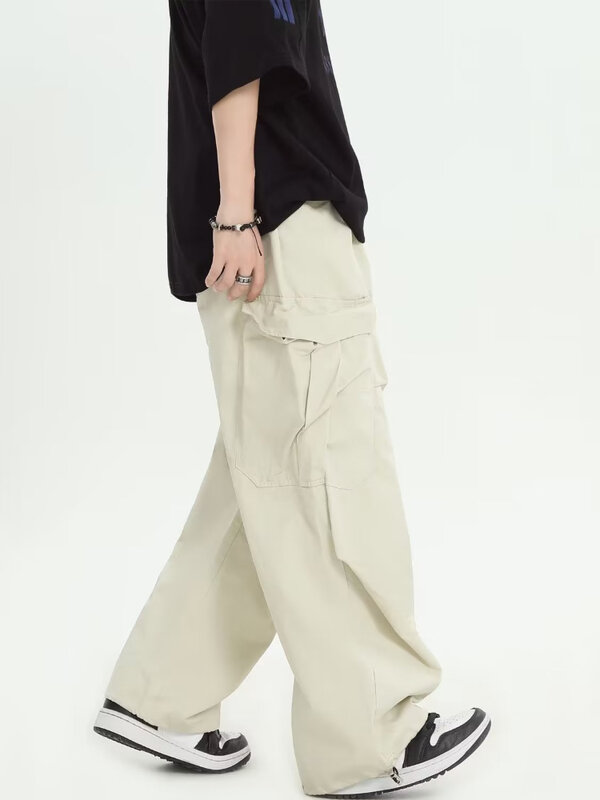 Calça plissada monocromática estilo safari para homens, bolsos grandes, roupa de rua larga, calças simples e largas, moda americana, nova para treino