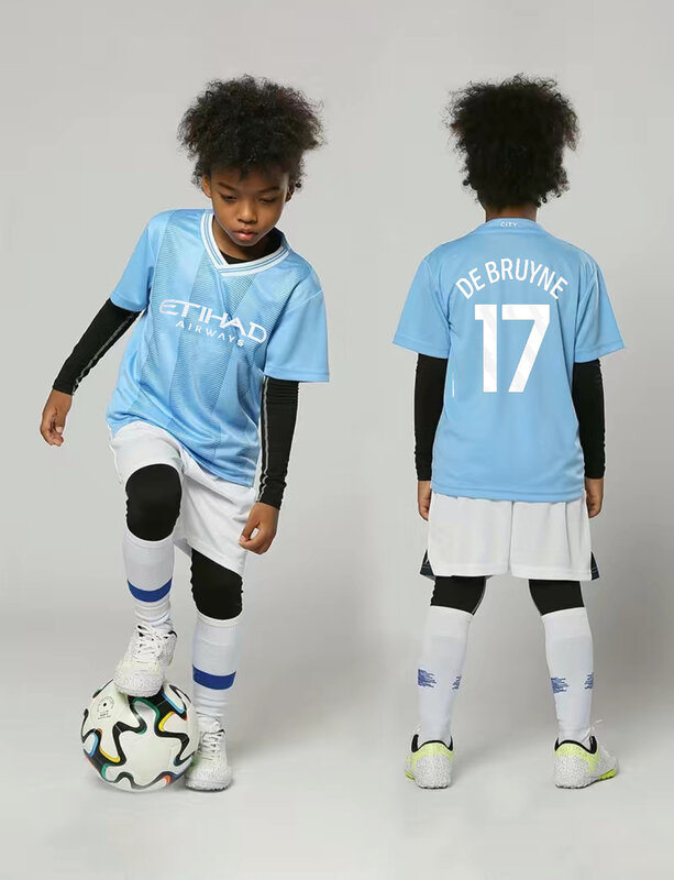 ชุดเสื้อเจอร์ซีย์สำหรับผู้ชายและเด็กแขนสั้นชุดเสื้อทีมฟุตบอลสำหรับเด็กชายและเด็กหญิง Kaus Sepak Bola