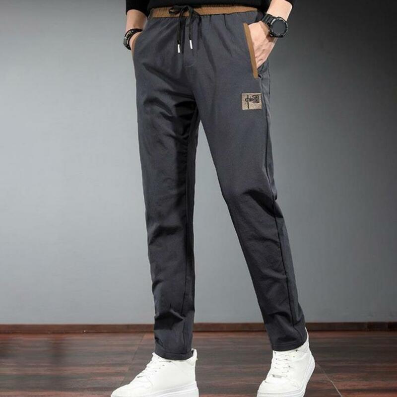 Jednokolorowe spodnie ze sznurkiem męskie elastyczne spodnie Cargo ze sznurkiem i boczne kieszenie letnie spodnie dresowe z prostymi nogawkami na zewnątrz