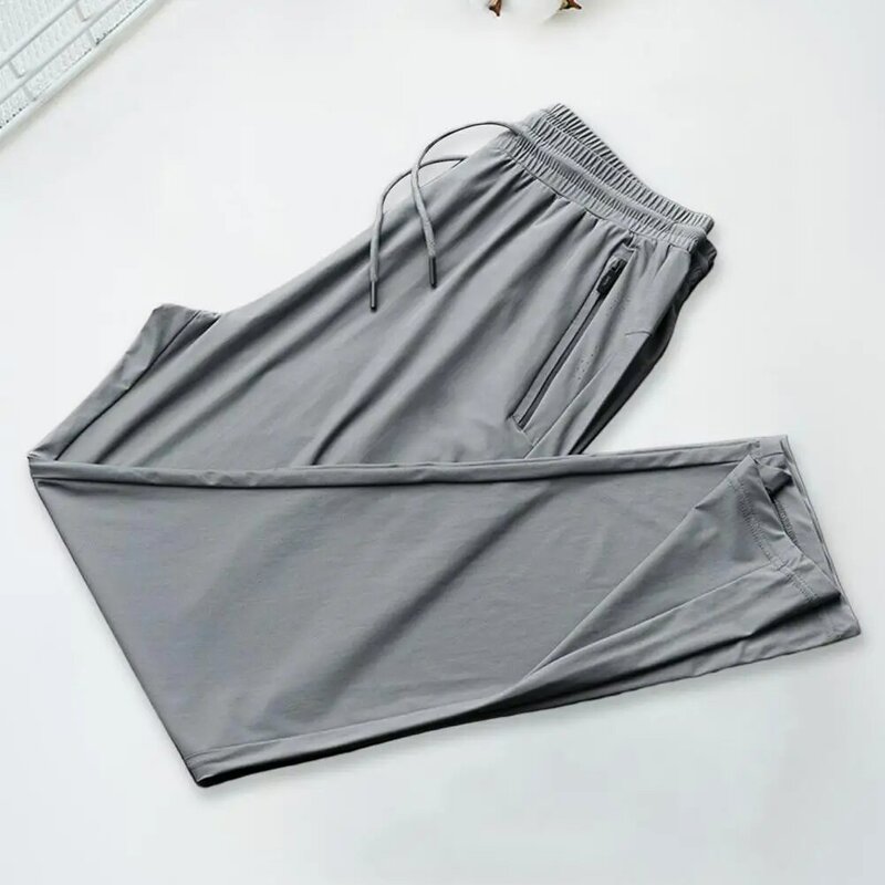 Calça esportiva respirável masculina de seda gelada para corrida fina de verão, malha solta, calças com ar condicionado, secagem rápida, 9 pontos