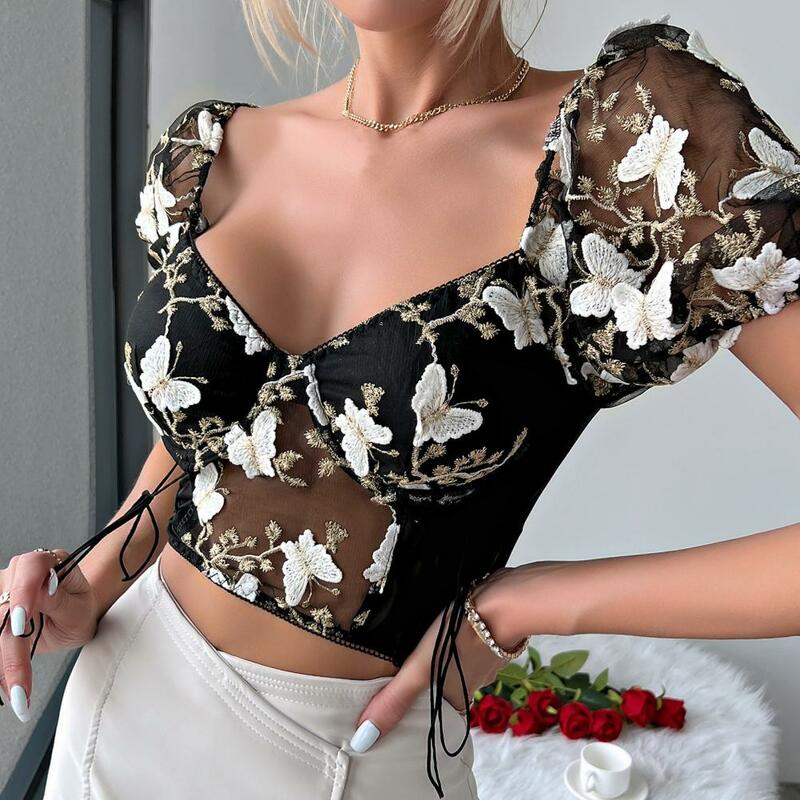 Top damski haftowana dekoracja bluzka stylowa siateczka łączenie haftowany wzór kwiatowy damskie krótkie bluzki z boku dla kobiet