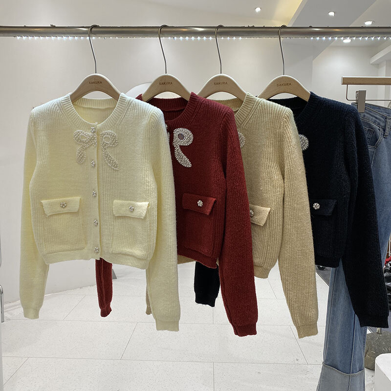 Miiiix-suéter con lazo de sensación de diseño francés para mujer, Chaqueta corta, cárdigan de punto de manga larga, suelto y cálido, invierno, nuevo, 2024
