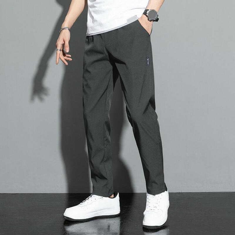 Męskie spodnie cienkie, średnio wysoka talia elastyczne spodnie na co dzień szybkoschnące, luźne spodnie męskie w jednolitym kolorze