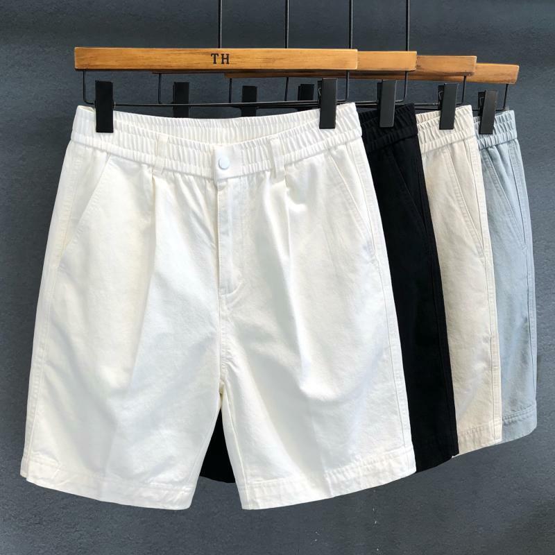 Koreańska moda kostium na lato spodnie męskie elastyczna talia jednolity kolor kieszonkowy Trend wszechstronny luźny prosty wygodne szorty do kolan