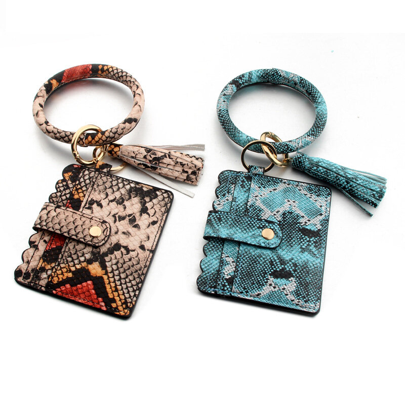 ขายใหม่พวงกุญแจสำหรับผู้หญิงผู้ชายเสือดาวOกระเป๋าสตางค์PUหนังพู่กระเป๋างูสร้อยข้อมือดอก...