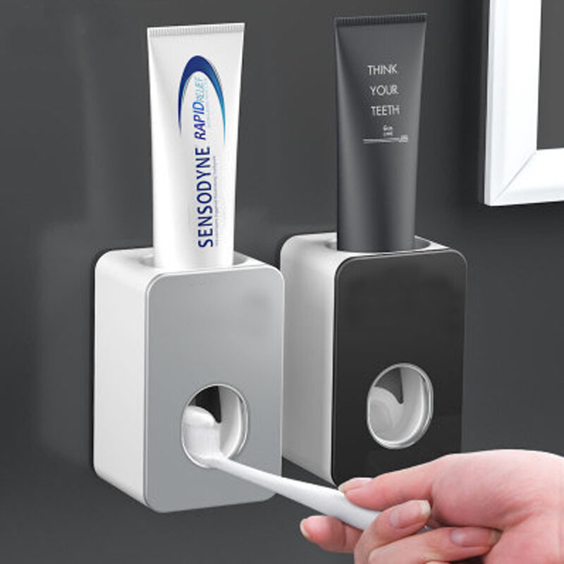 Espremedor de pasta de dentes automático. Distribuidor perfurado fixado na parede da pasta de dentes