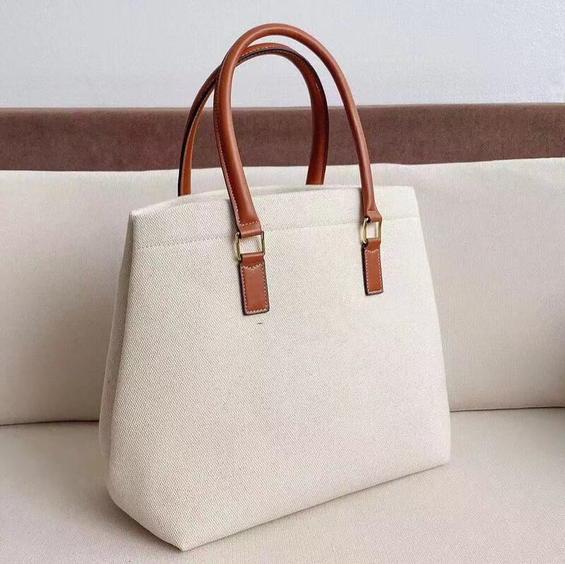 2021 klassische weibliche luxus handtasche mit high-grade leinwand mit kontras farbe rindsleder griff, große kapazität einkaufstasche.