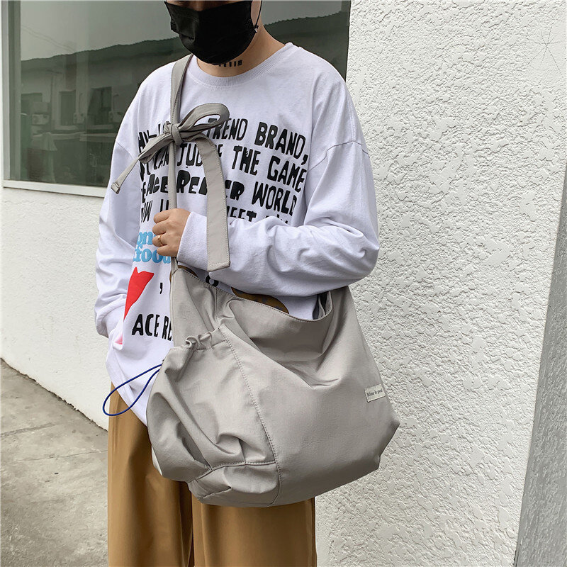 Nova moda cruz tendência bolsa de lona masculina e feminina mesma alta capacidade bolinho macio cruz saco impermeável bolsa tote