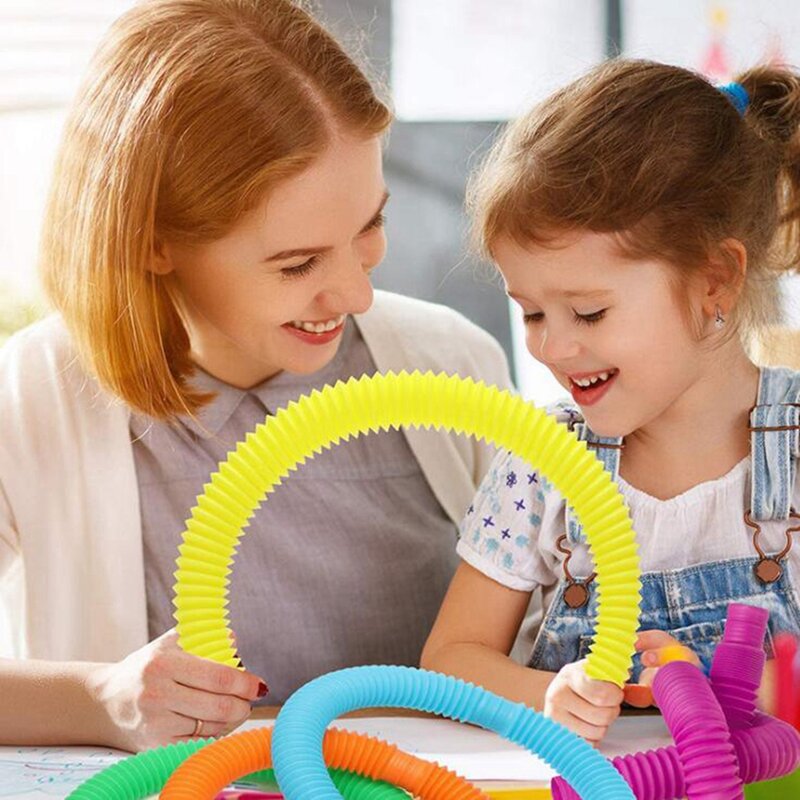 Bobine de Tube Pop magique en plastique coloré, jouets en cercle, jouets amusants, développement précoce, jouet éducatif pliable