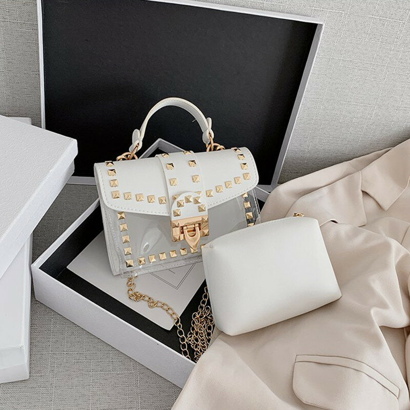 العلامة التجارية مصمم امرأة 2020 موضة جديدة حقيبة ساعي سلاسل حقيبة الكتف الكورية الإناث المسامير شفافة صغيرة مربع بو حقيبة يد