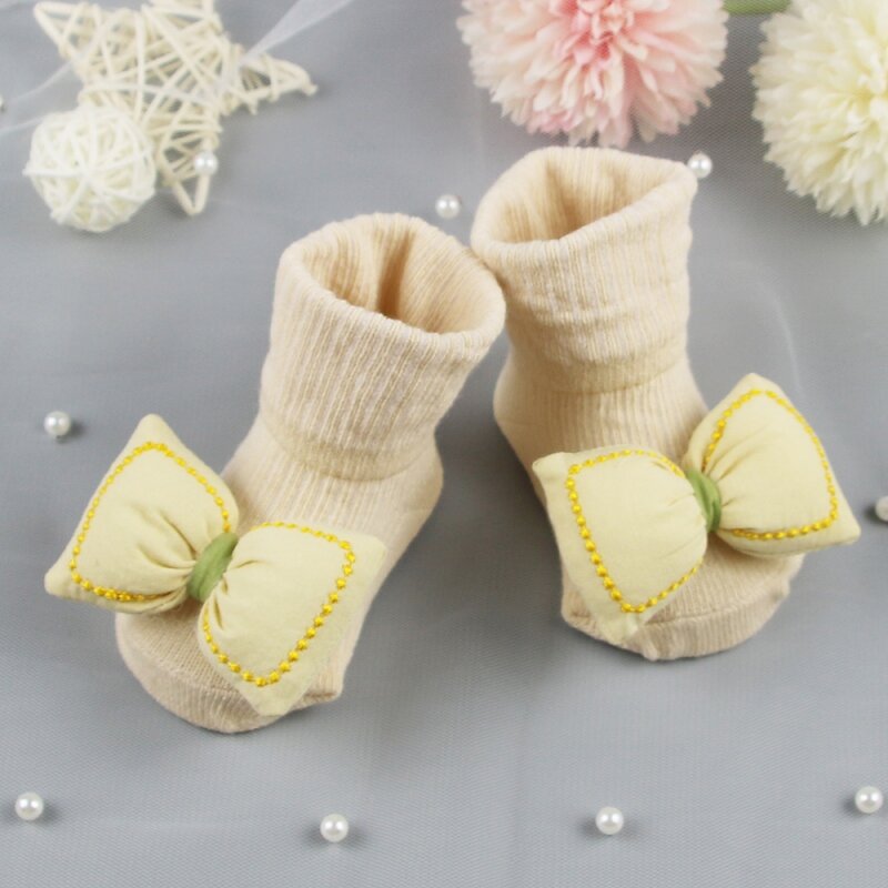 Bebé recién nacido niña niño Bowknot lindo calcetines de algodón bebé Anti-slip caliente calcetines medio tubo calcetines de punto
