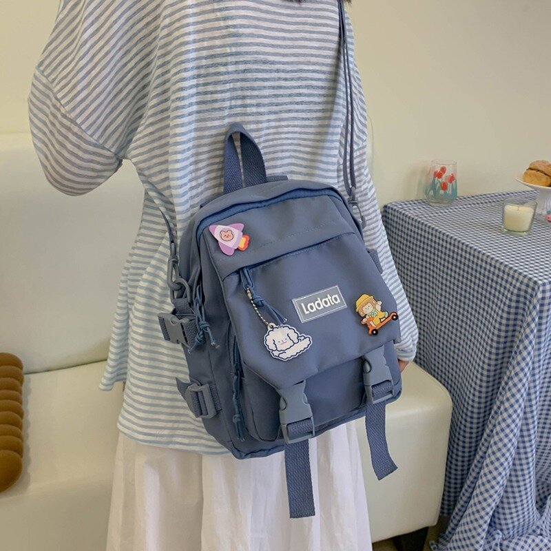 Mochila escolar feminina, bolsa pequena de nylon à prova d'água para escola e faculdade, multifuncional com emblema para meninas