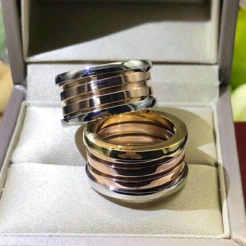Fashion charm-anel de titânio com mola para homem e mulher, jóias de festa de noivado, logotipo clássico, original