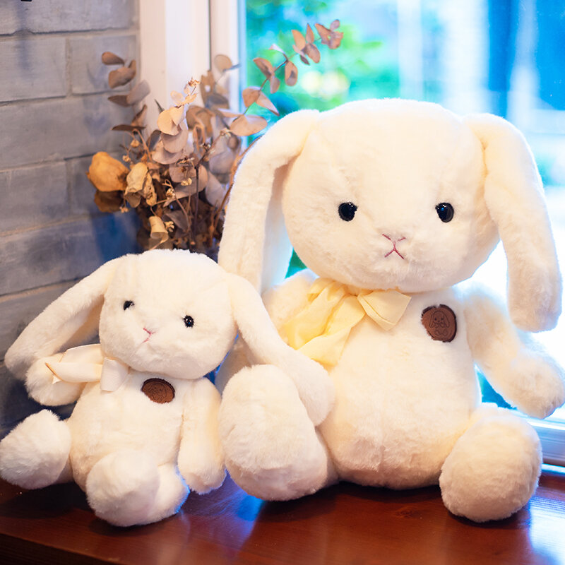 Bambola del coniglio in erba dell'orecchio lungo della bambola del giocattolo della peluche del coniglio rosa sveglio