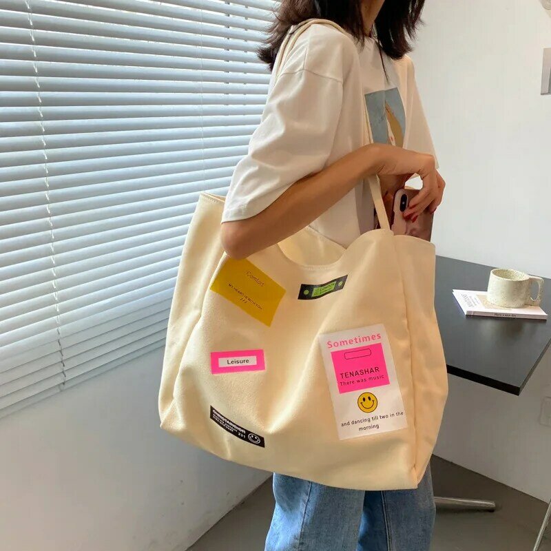 솔리드 컬러 캔버스 가방 2021 새로운 기능 여성 가방 대용량 간단한 패션 한 어깨 예술적 경사 스팬 가방