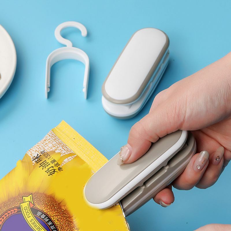 プラスチック製の多機能ポケットを備えた小型でポータブルな熱可塑性食品包装機