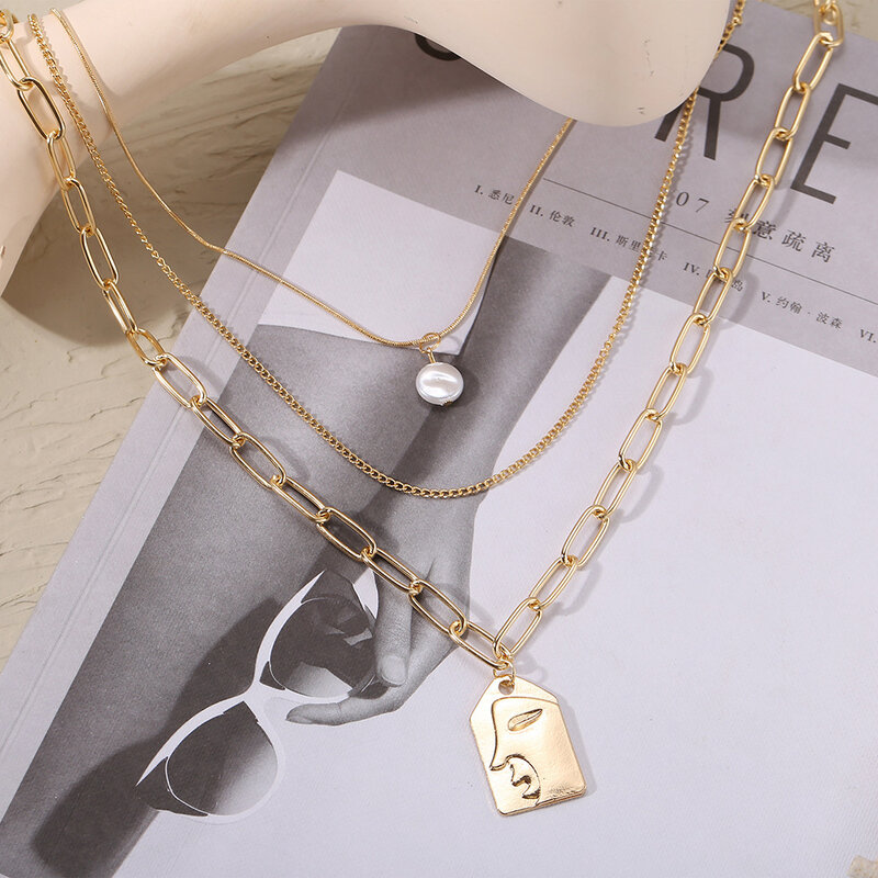 European and American new alloy multilayer pearl embossed face pendant necklace female fashion creative clavicle chain