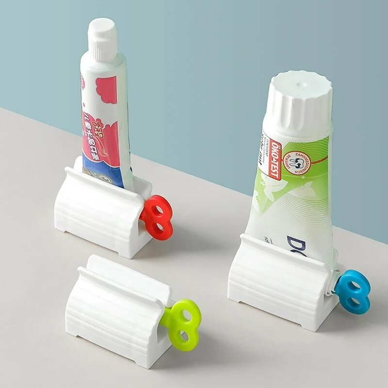 Dentifricio detergente viso spremere pressa rotolamento dentifricio dispositivo Dispenser tubo accessori per la pulizia dei denti del bagno