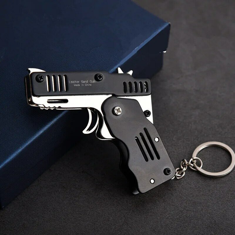 Mini pistola dobrável para ar livre, ferramentas de dobrar para segurar a chaveiro da pistola de borracha com seis explosões feito todas as armas de metal, arma de tiro, presentes de brinquedo para meninos