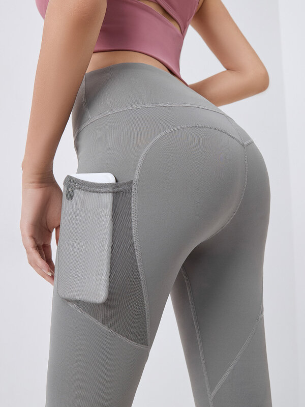 Tasche per pantaloni da Yoga fondo per sollevamento dell'anca vestiti per Yoga ad asciugatura rapida tasche laterali in Mesh elasticizzato traspirante pantaloni da corsa per Fitness