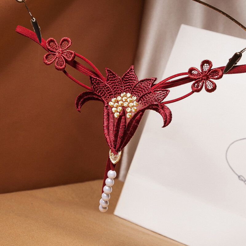 Seksowne majtki koronkowe Hollow Pearl żakardowe otwarte majtki niskiej talii elastyczne pokusa jeden sznur kwiat krocza stringi