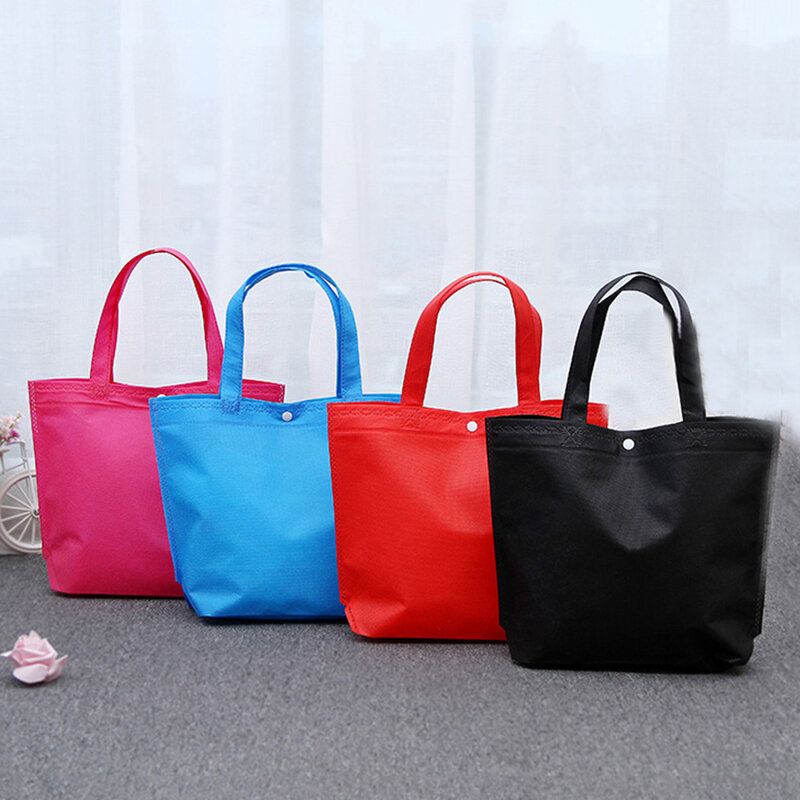 Nova chegada qualidade reutilizável dobrável botão saco de compras durável não-tecido tote bolsa de armazenamento mercearia eco sacos amigáveis