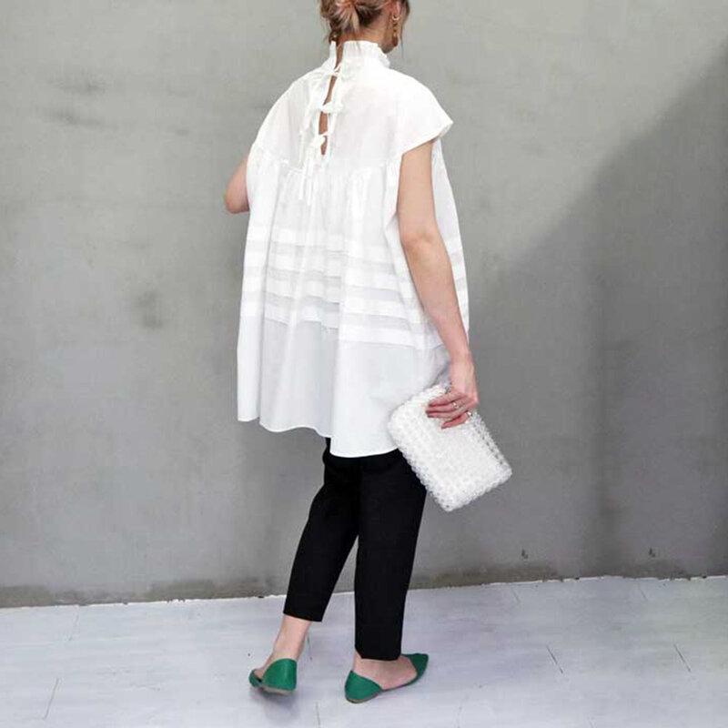 Camicia bianca da donna senza maniche giovane camicetta bianca nera Vintage elegante colletto alla coreana tinta unita top Casual camicie lunghe estate