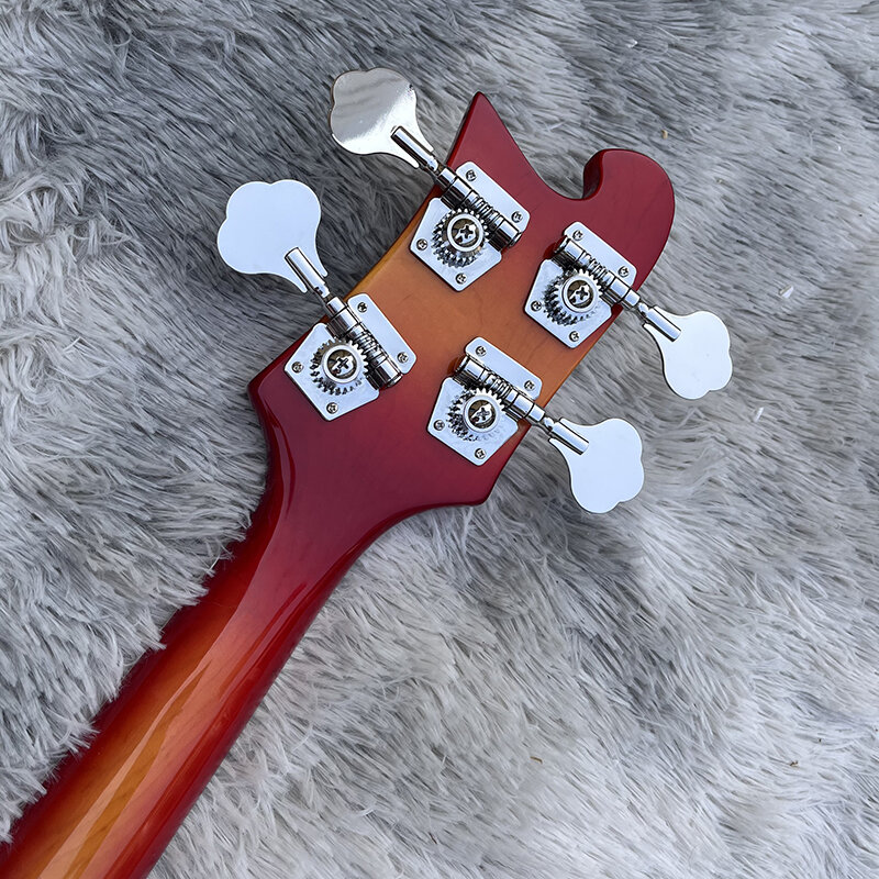 Это профессиональная 4-струнная бас-электрическая гитара с меняющим цвет лицом заката. У него красивый тон