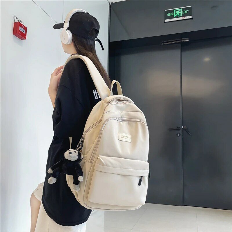 กระเป๋าเป้สะพายหลังของผู้หญิงสีทึบ Multi-Pocket กระเป๋าเดินทางคุณภาพสูงเกาหลี Campus หญิงขนาดใหญ่ควา...