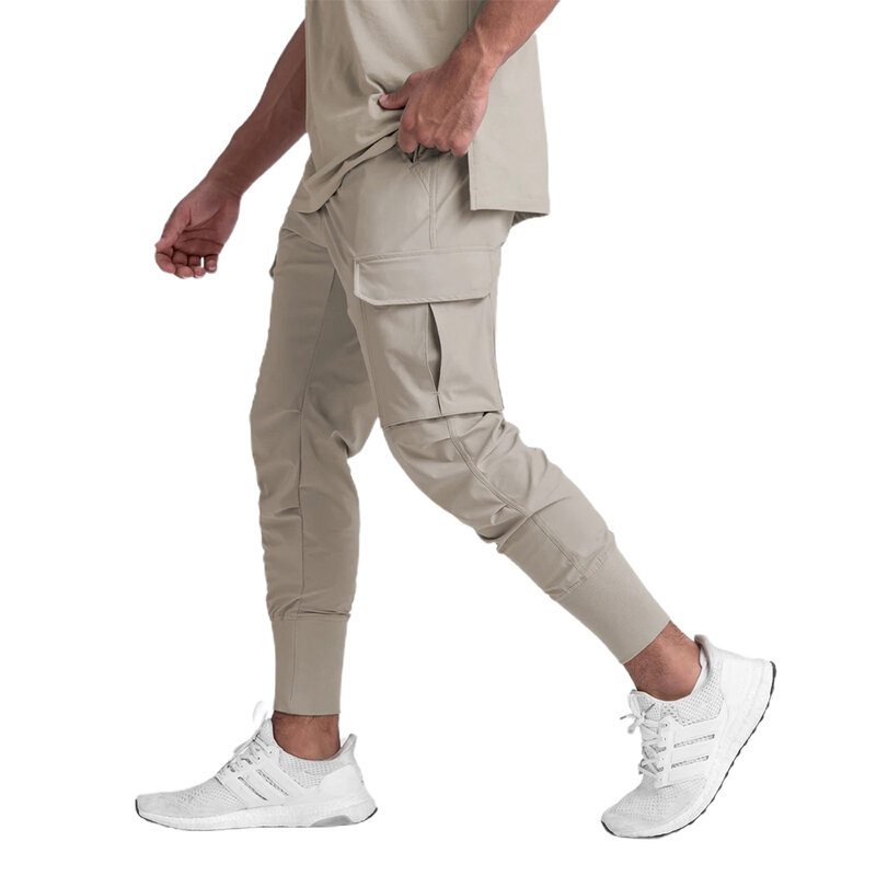 Pantalones ajustados con bolsillos para hombre, ropa de moda de Color sólido con cintura elástica, novedad de 2022