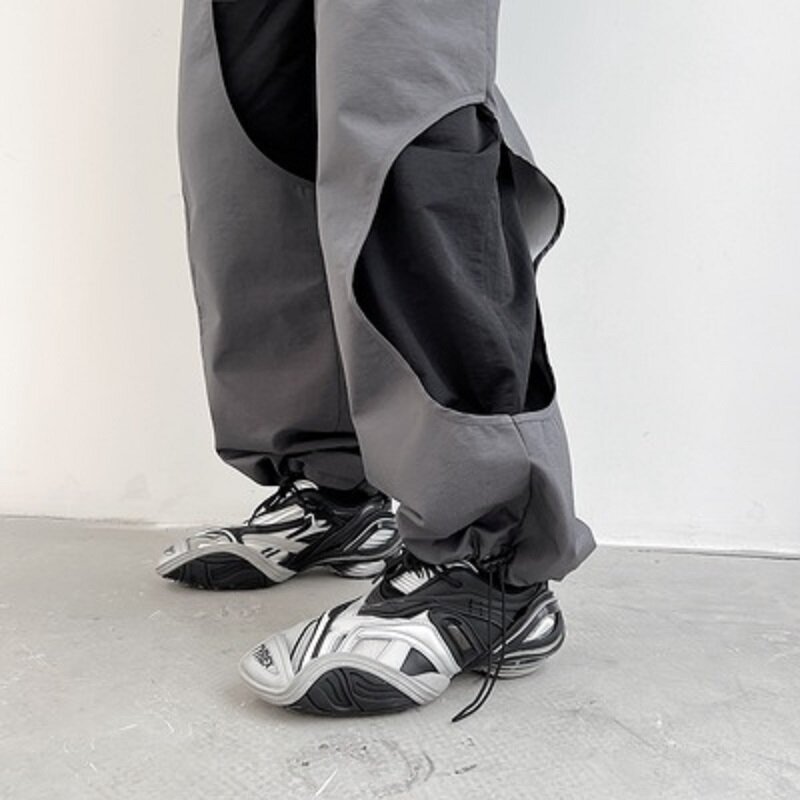 Eleganckie męskie spodnie dorywczo dwuwarstwowa dziura Patchwork projektant męskie spodnie Gey kontrast czarny zamek koreański Hipiee ubrania spadek