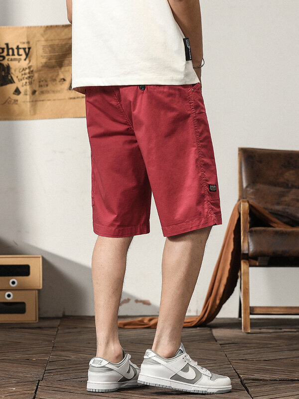 Letnie szorty Cargo męskie multi-kieszenie do kolan oddychające elastyczny bawełniany w stylu Casual, biurowy krótkie spodnie męskie proste szorty plażowe